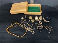Wood box of assorted jewelry