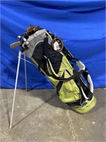 Ogio golf bag filled with miscellaneous putters