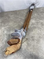 Vintage wooden golf clubs with vintage leather