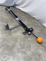 Variety of training clubs and golf umbrella