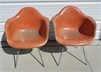 Pair of Orange Fiberglass Herman Miller Chairs