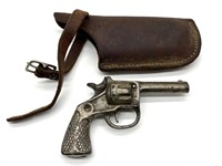 Vintage Metal Toy Gun and Leather Holster
- gun