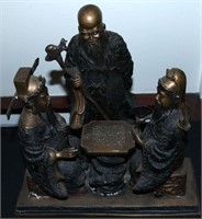 A 20TH C. CHINESE BRONZE GROUP OF MEN PLAYING GO