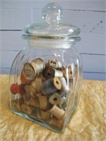 GLASS CANISTER W/ WOODEN SPOOLS