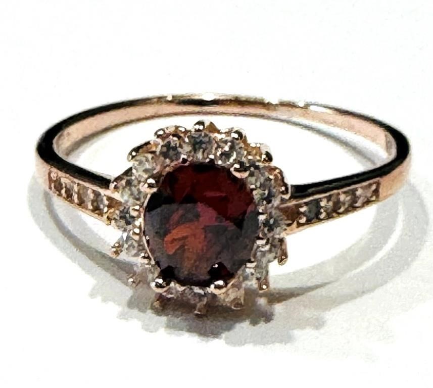 SOPHISTCATED OVAL GARNET/CZ GOLD TONE RING