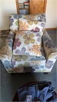 Floral chair with throw pillows