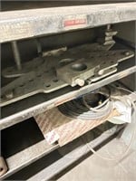Contents of metal rack includes cut off wheels