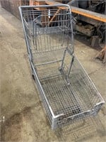 Metal shopping cart on wheels