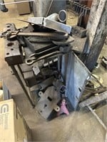 Small table with miscellaneous tools, clamp