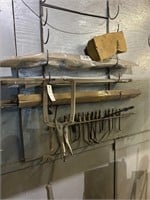 Wall lot with welding rods, C clamp torch tips in