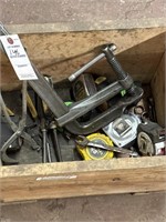 Wooden crate with tools, clamps wrenches,