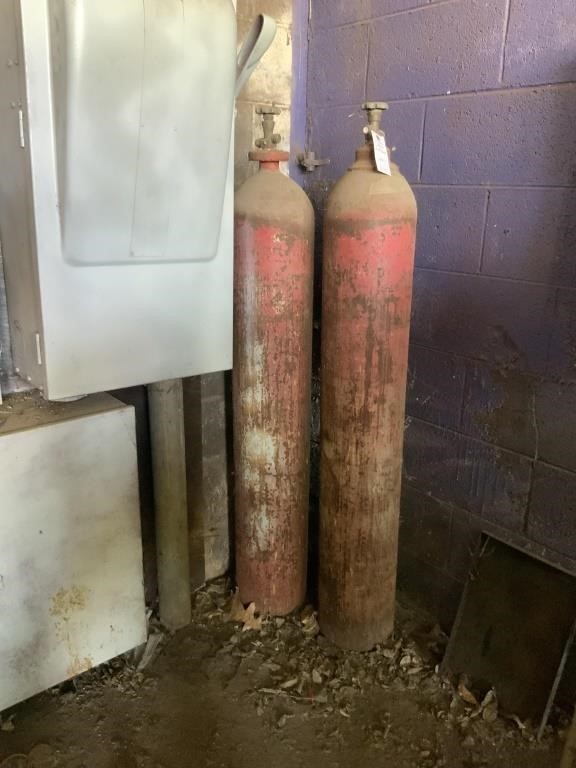 Two tall cylinder, gas tanks