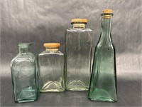 Green and Clear Glass Corked Bottles
