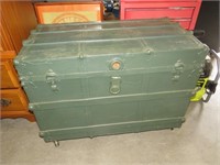 LARGE ANTIQUE TRUNK ON ROLLERS