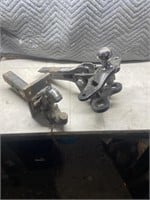 Pair of receiver hitches one is a pintle and the