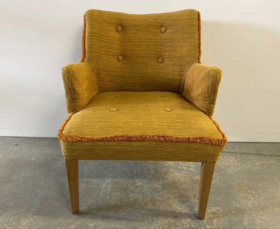 Mid century upholstered armchair;