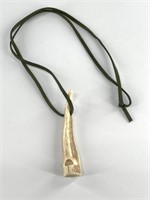 Whistle made from deer antler and green leather co