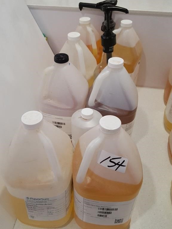 lot part full jugs of syrups