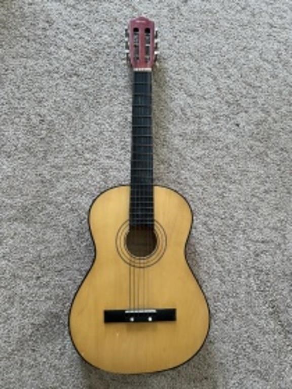 Child size guitar. T. A. Lawrence model number