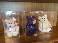 Three beanie babies in case. Includes princess.