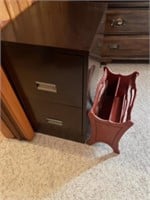 Two drawer metal filing cabinet and red magazine