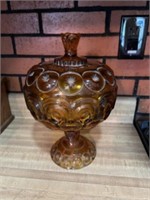 Covered Amber dish stands approximately 13 inches