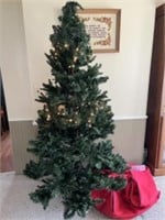 9 foot Christmas tree with rolling storage bag. I
