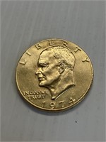1974 gold tone "Ike" dollar