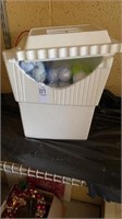 Small ripped styrofoam cooler filled with golf
