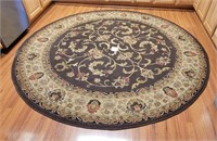Large Round Area Rug Shows Wear