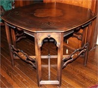 A 1930s BURL INSET CENTER TABLE WITH INCISED DECOR