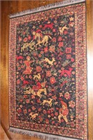 A MACHINE MADE PERSIAN HUNT PATTERN RUG