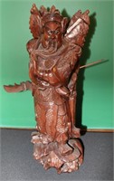 A CHINESE CARVED HARDWOOD FIGURE OF GUAN GONG