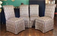 A SET OF FOUR SKIRTED PARSONS CHAIRS