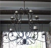 A TWELVE-CANDLE WROUGHT IRON CHANDELIER