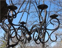 A WROUGHT IRON SIX-ARM CANDLE CHANDELIER