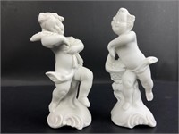 Porcelain cherubic figurines.  4.5" tall ,