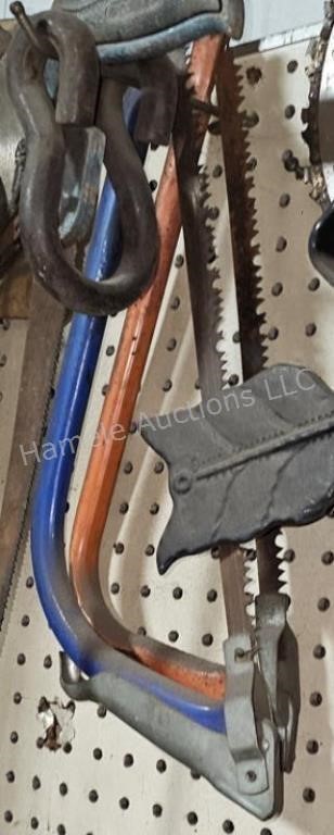 Hand pruning saws - red and blue - in shop