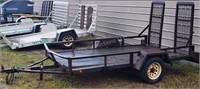 Utility trailer #4 with ramp - 10' x 64" - in yard