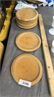 Eight wooden plates