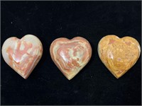 3 carved onyx stone hearts.