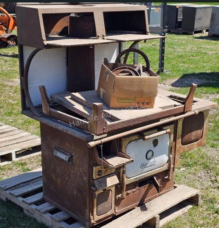 Antique woodstove with stand and burner plates