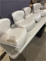 Four Crestliner boat seats one show signs of wear
