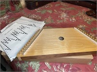 Zither with sheet music