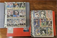 2 BOOKS LOADED WITH BASEBALL CARDS- 1 ORIOLES