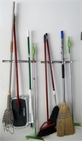 LOT VAR. BROOMS, DUSTER AND MOP ON WALL