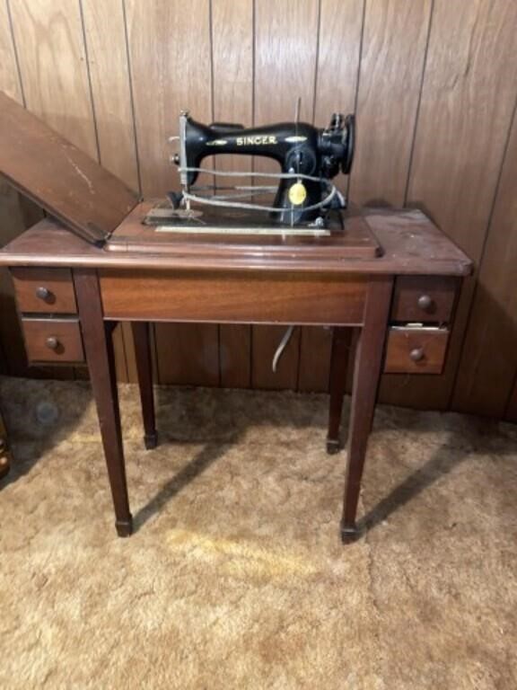Singer sewing machine in cabinet
