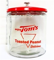 Round glass Tom's Peanut jar w/ red metal lid