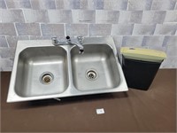 Double sink with taps and a paper shredder