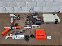 Nintendo entertainment system with controllers etc